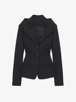 Giacca con harness e spalle scoperte da Donna in Nero